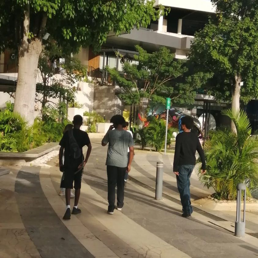 teen boys walking at mall